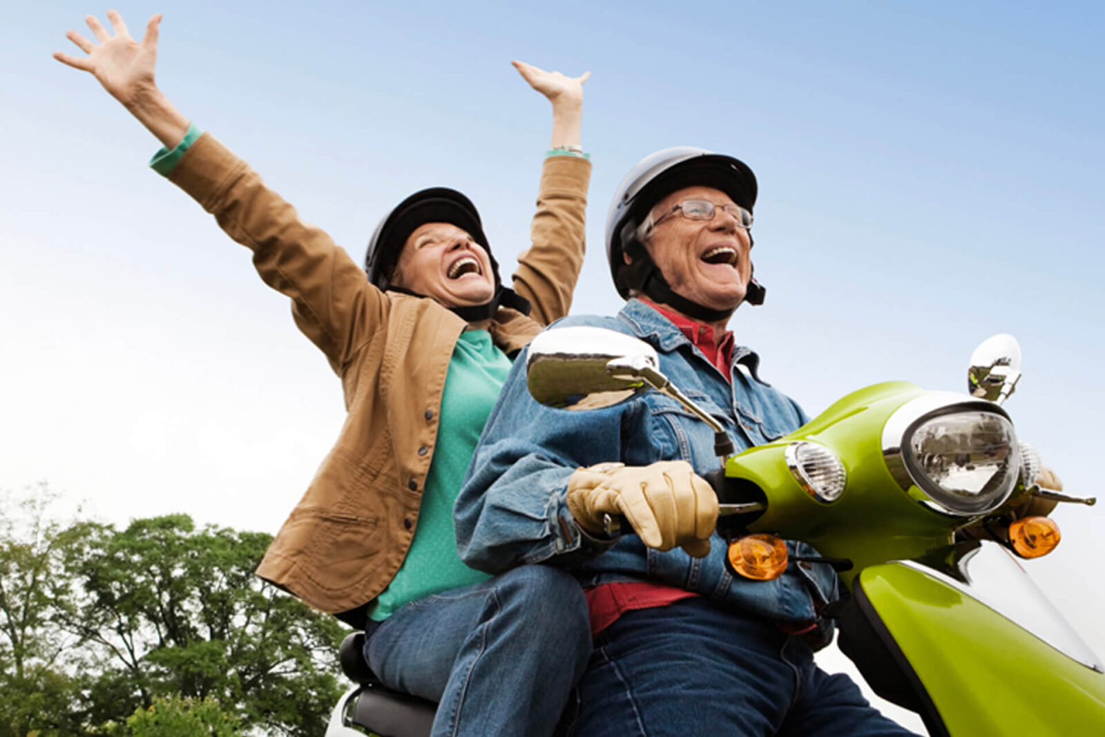 senior couple on vespa