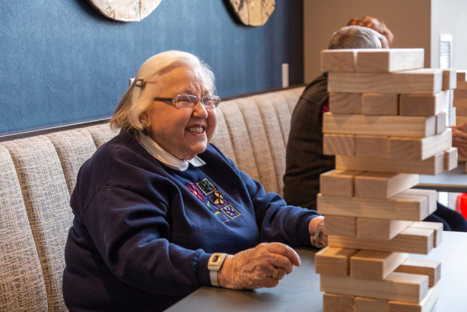 senior woman playing jenga