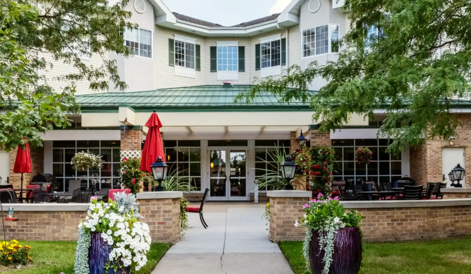 Exterior view of Cottage Grove Place senior living community with landscaped grounds