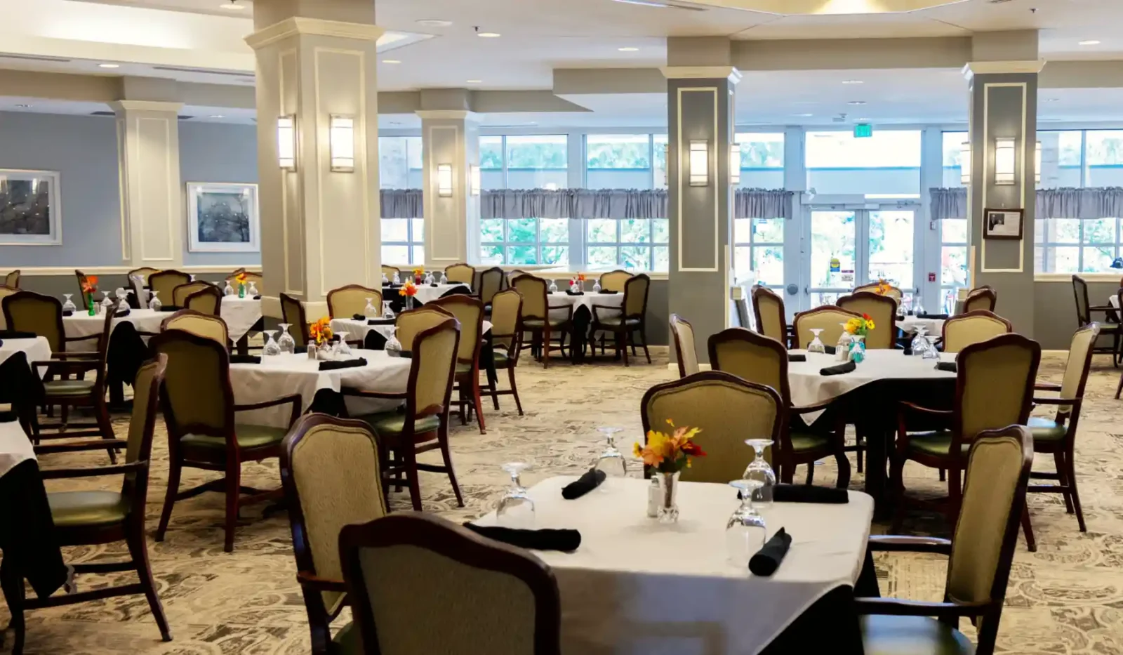 Dining room at Cottage Grove Place senior community with elegant table settings