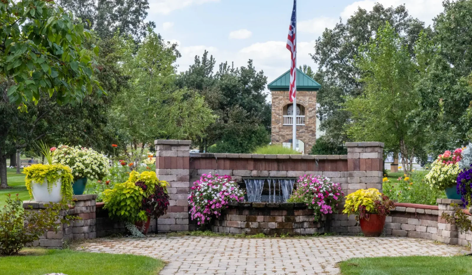 Exterior view of Cottage Grove Place senior living community with landscaped grounds