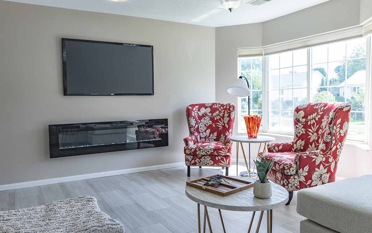 Spacious living room in a Cottage Grove Place apartment with natural light