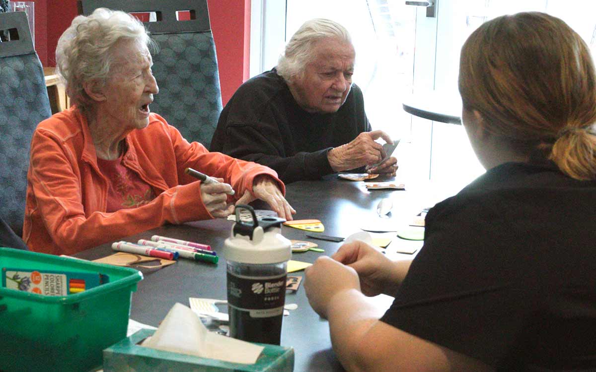 Residents participating in an arts and crafts activity at Cottage Grove Place senior living community