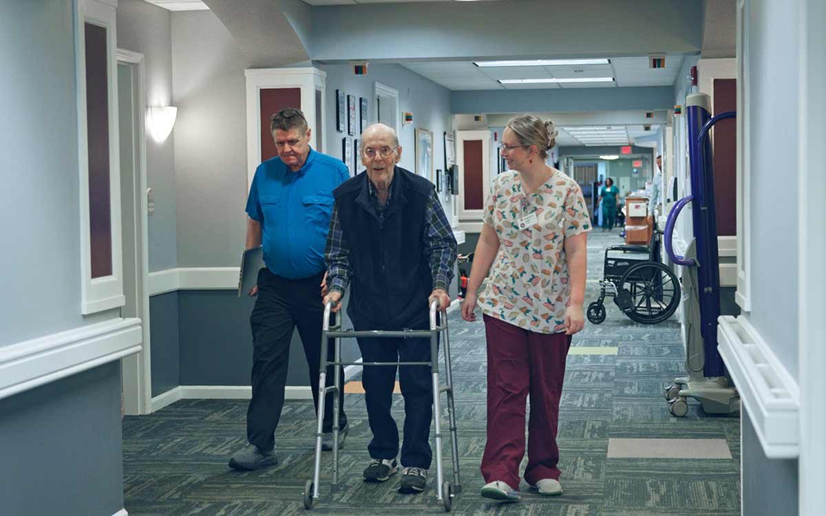 Resident receiving personalized health care support at Cottage Grove Place