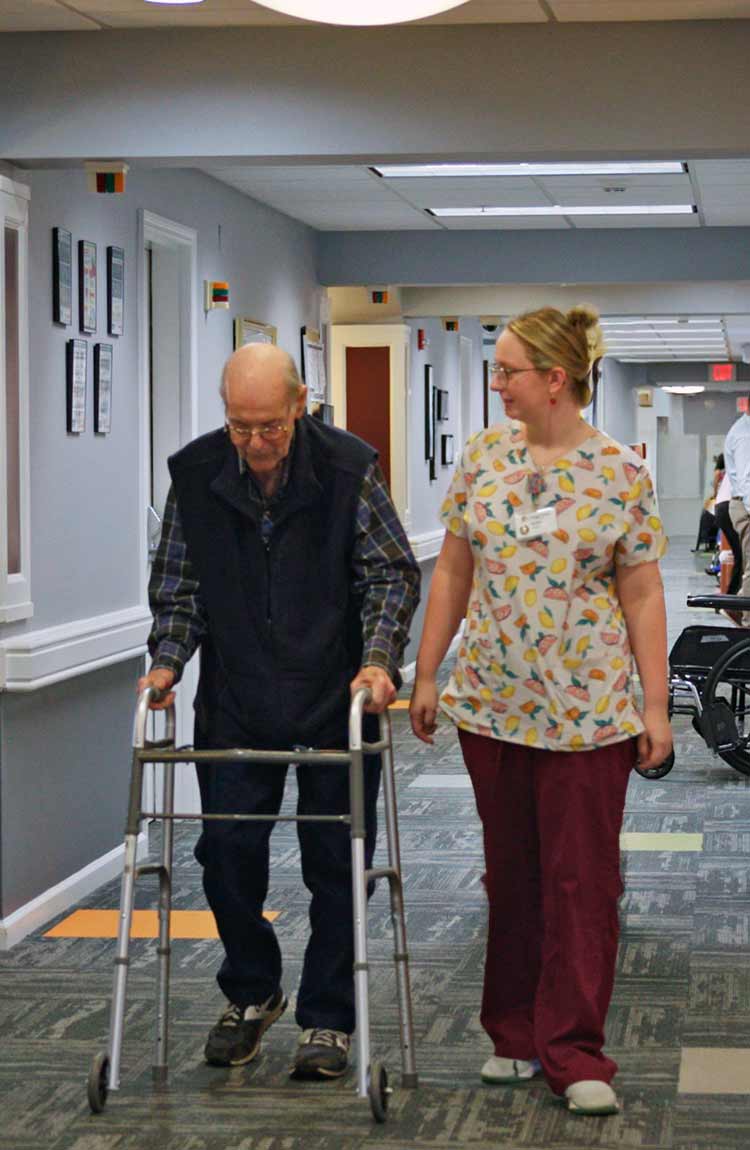 Resident receiving personalized health care support at Cottage Grove Place