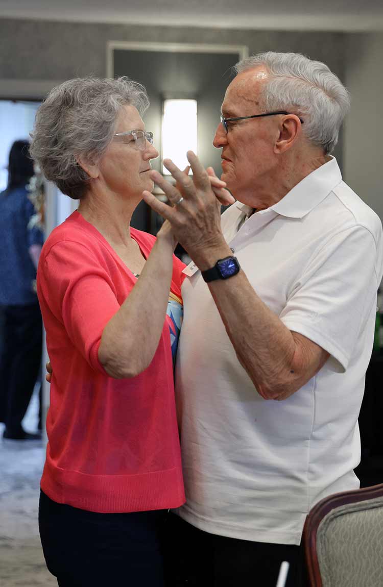 Residents dancing together at Cottage Grove Place senior living community