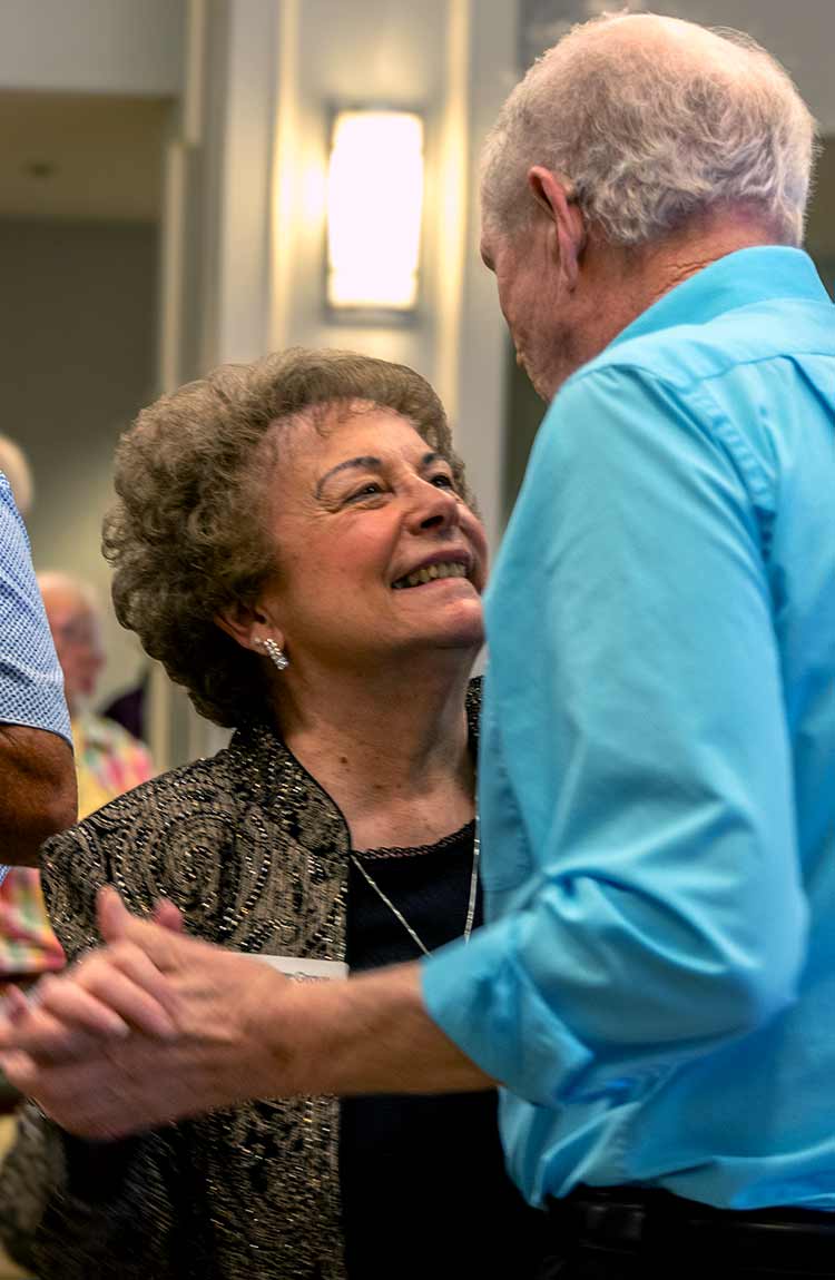 Residents dancing together at Cottage Grove Place senior living community