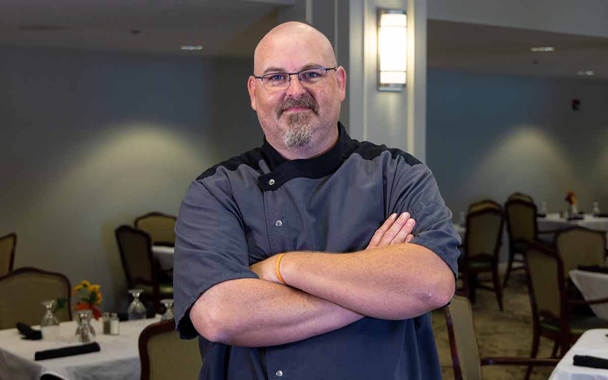 Chef Spalding stands proudly in the Cottage Grove dining hall