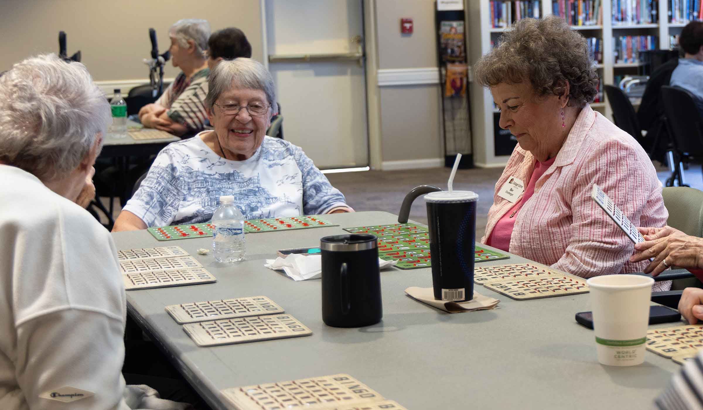 Group of seniors enjoying a bingo game at Cottage Grove Place