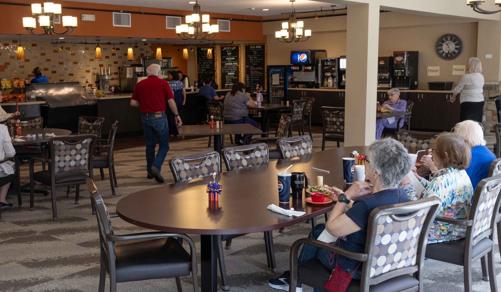 Spacious dining room at Cottage Grove Place with tables and seating