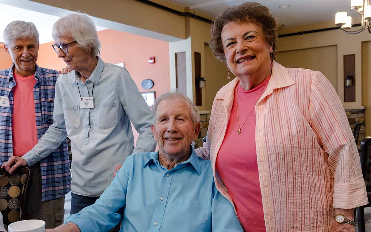 group of elderly people posing for the camera.