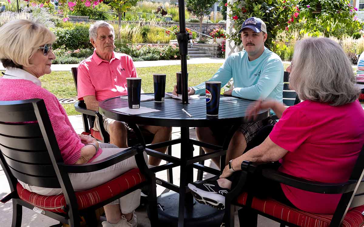 Residents participating in a social activity at Cottage Grove Place senior community