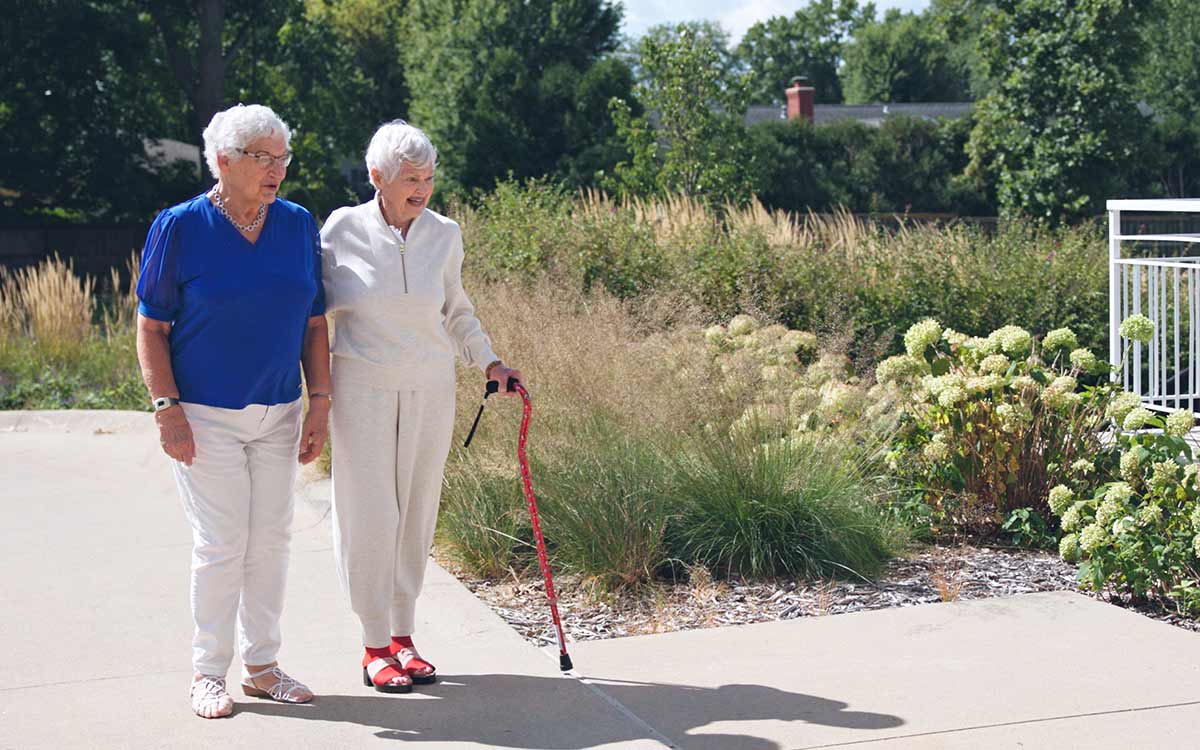 Residents sharing a joyful moment at Cottage Grove Place senior community