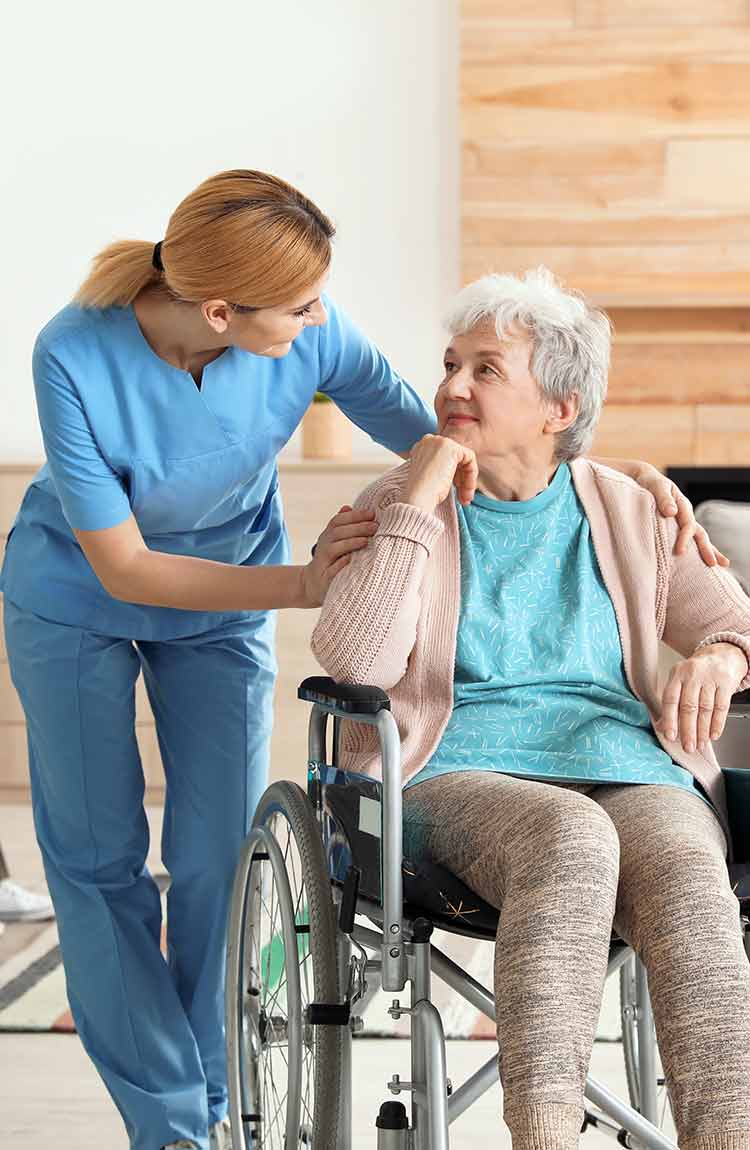 Nurse providing assisted living support to a resident at Cottage Grove Place senior community