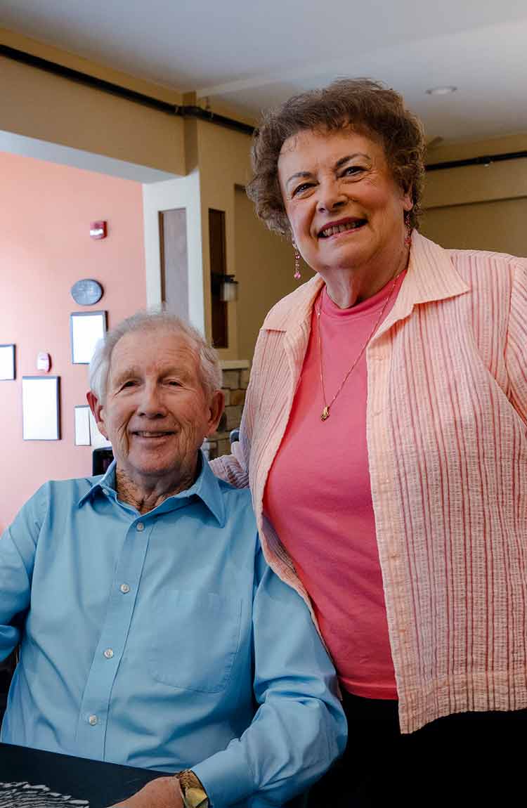 Senior couple smiling together at Cottage Grove Place senior living community