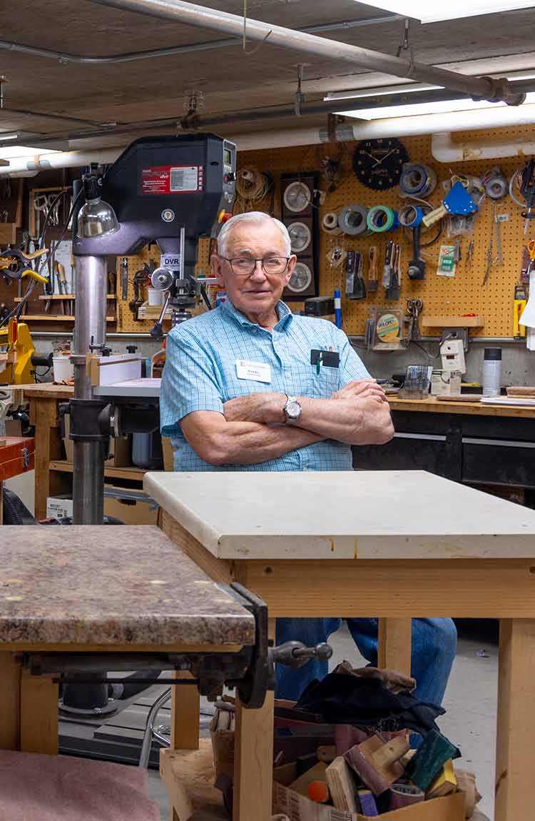Senior man working in the woodworking shop at Cottage Grove Place