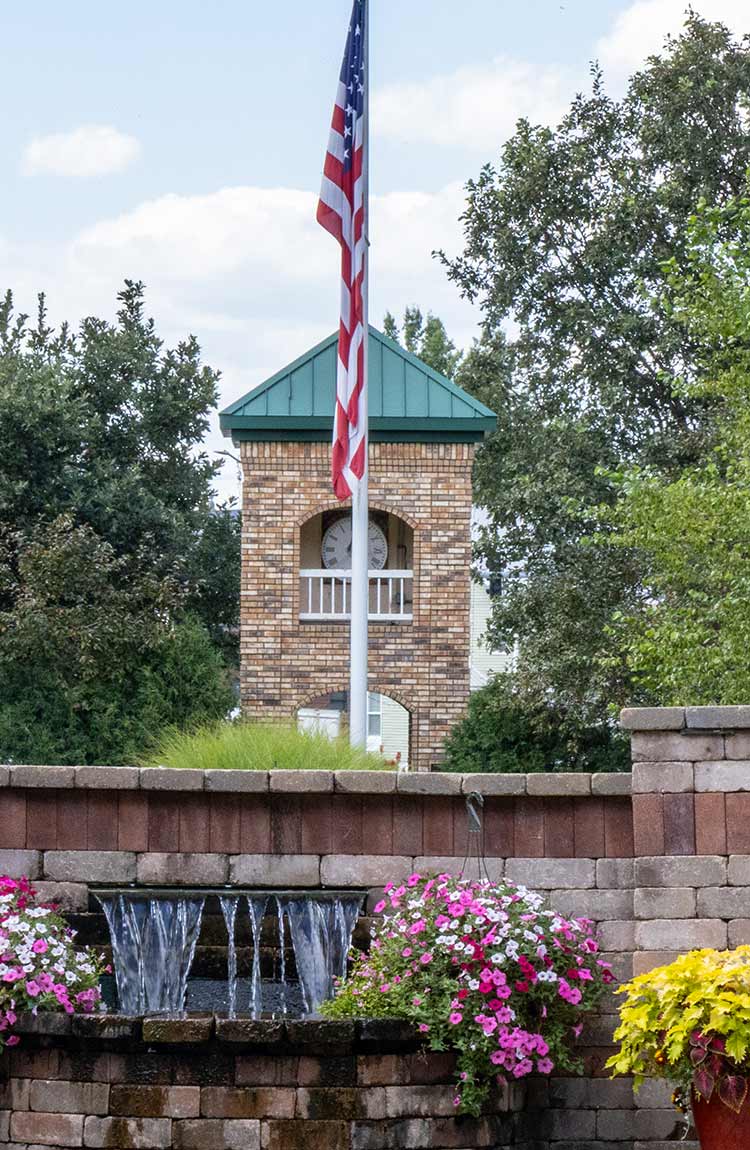 Exterior view of Cottage Grove Place senior living community with landscaped grounds