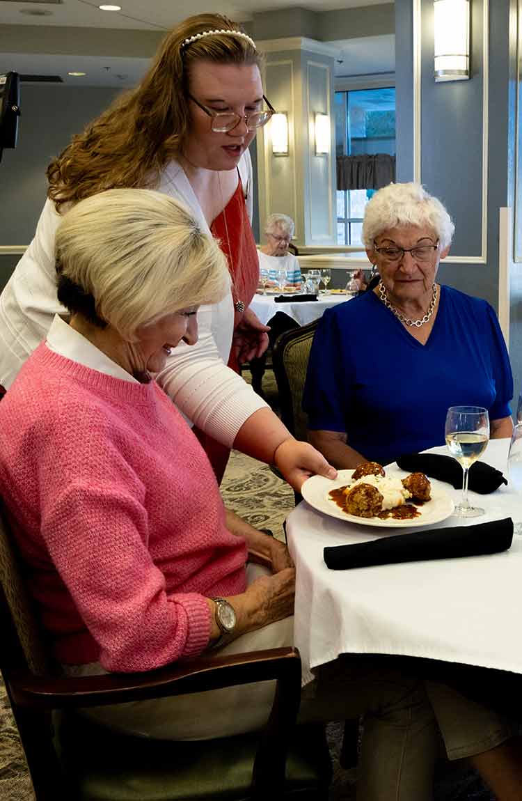 Restaurant-style dining experience at Cottage Grove Place with plated food
